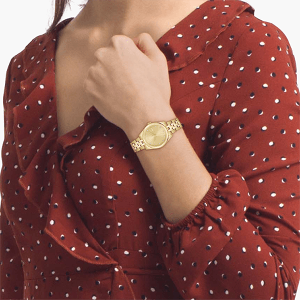 montre lacoste mouvement Quartz boîtier acier or jaune rond cadran or jaune bracelet acier or jaune